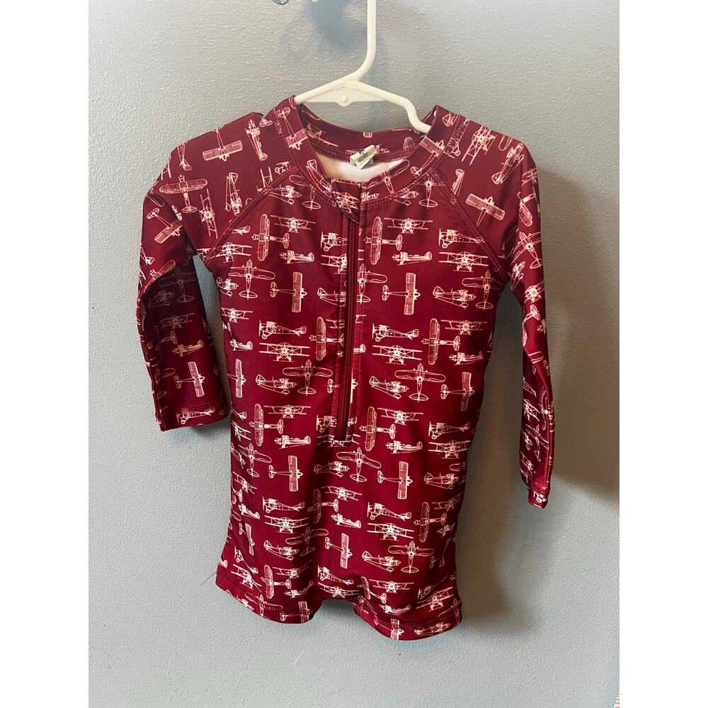 Kate Quinn Organics red airplane swim romper long sleeve